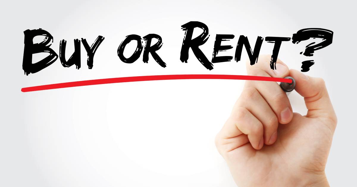 A man holds a red marker underlining the words "buy or rent" in black text written on a white background.